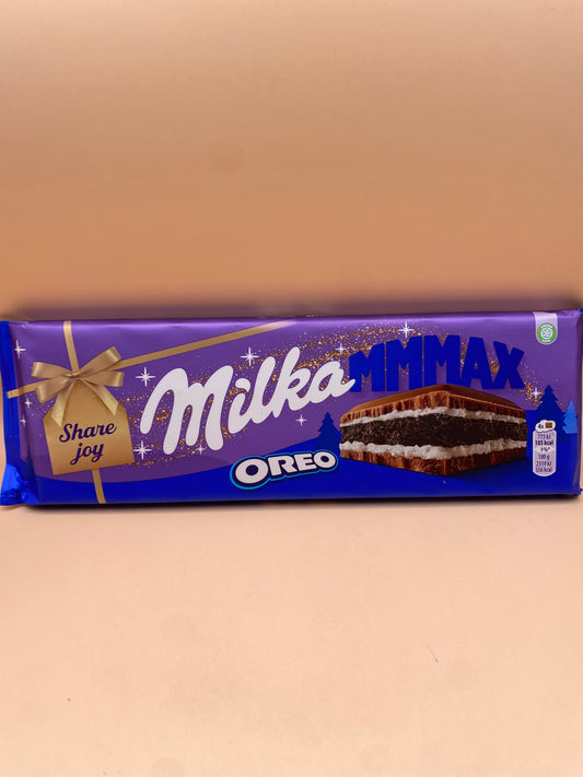 Milka Tejcsokoládé keksz darabokkal 300g